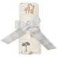 The Angel Dear Giraffe Families Swaddle Blanket, crafted by Angel Dear, features a charming giraffe print and is rolled up with a gray ribbon. This swaddle is made from soft and stretchy fabric, ensuring optimal comfort.