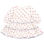 The Pink Chicken Girls' Julia Dress captures equestrian chic with its white long-sleeved design, showcasing chambray detailed tiers and delightful red horse prints on the tiered skirt.