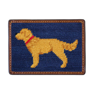 The Smathers & Branson Card Wallet features a rectangular patch with a hand-stitched yellow dog in a red collar on a dark blue background, bordered by brown leather—a charming design that showcases refined craftsmanship.