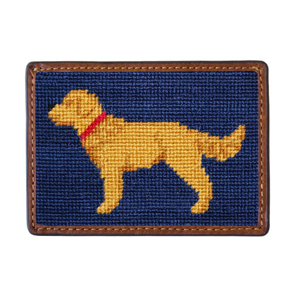 The Smathers & Branson Card Wallet features a rectangular patch with a hand-stitched yellow dog in a red collar on a dark blue background, bordered by brown leather—a charming design that showcases refined craftsmanship.