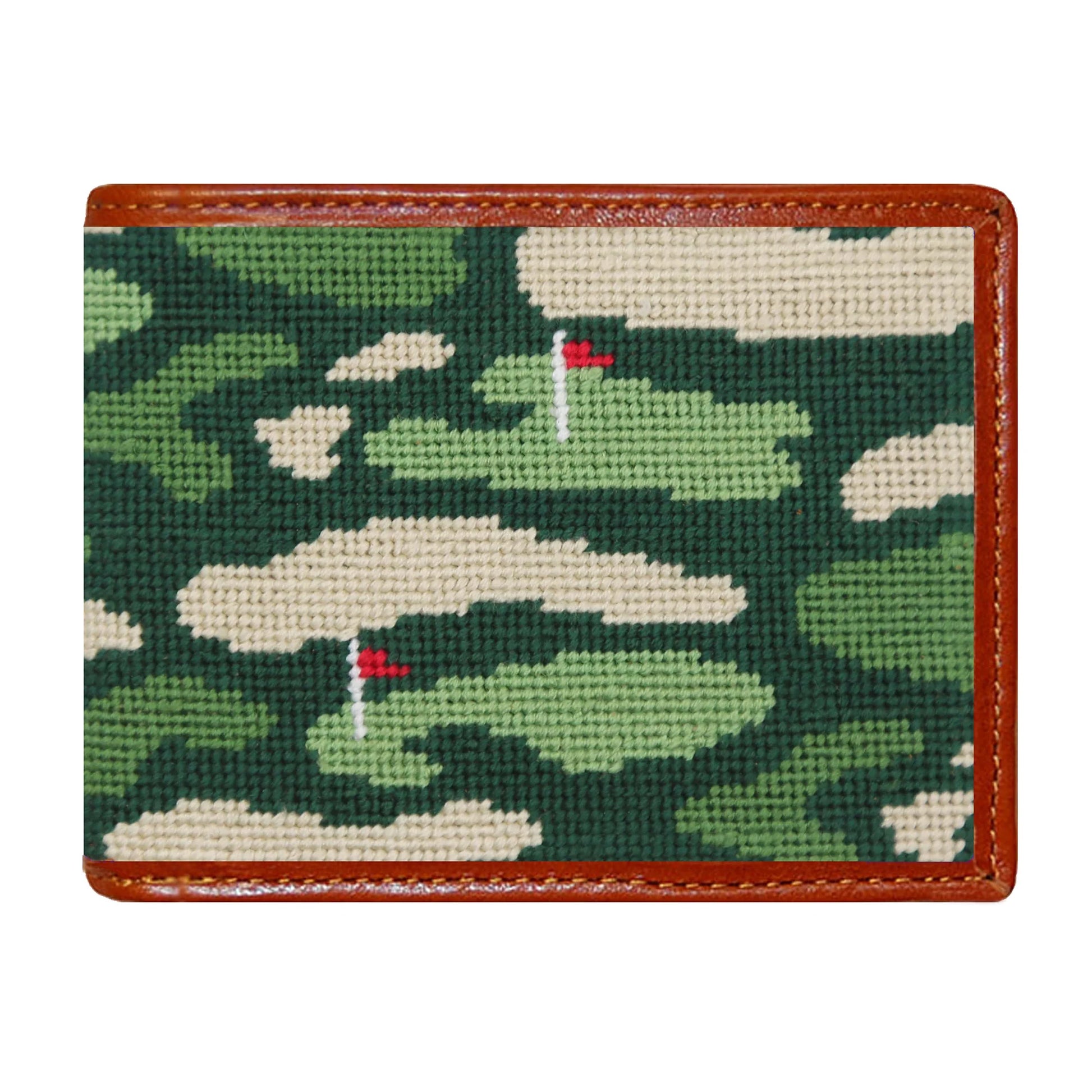 The Smathers & Branson Bi-Fold Wallet showcases a green and tan camouflage needlepoint design with stitched golf course flags, finished with luxurious brown Italian leather trim.
