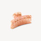 The Grande Heirloom Claw by Machete, crafted from premium Italian acetate in a marbled peach and cream design with interlocking teeth, is displayed against a plain white background—ideal for securing long, thick hair.