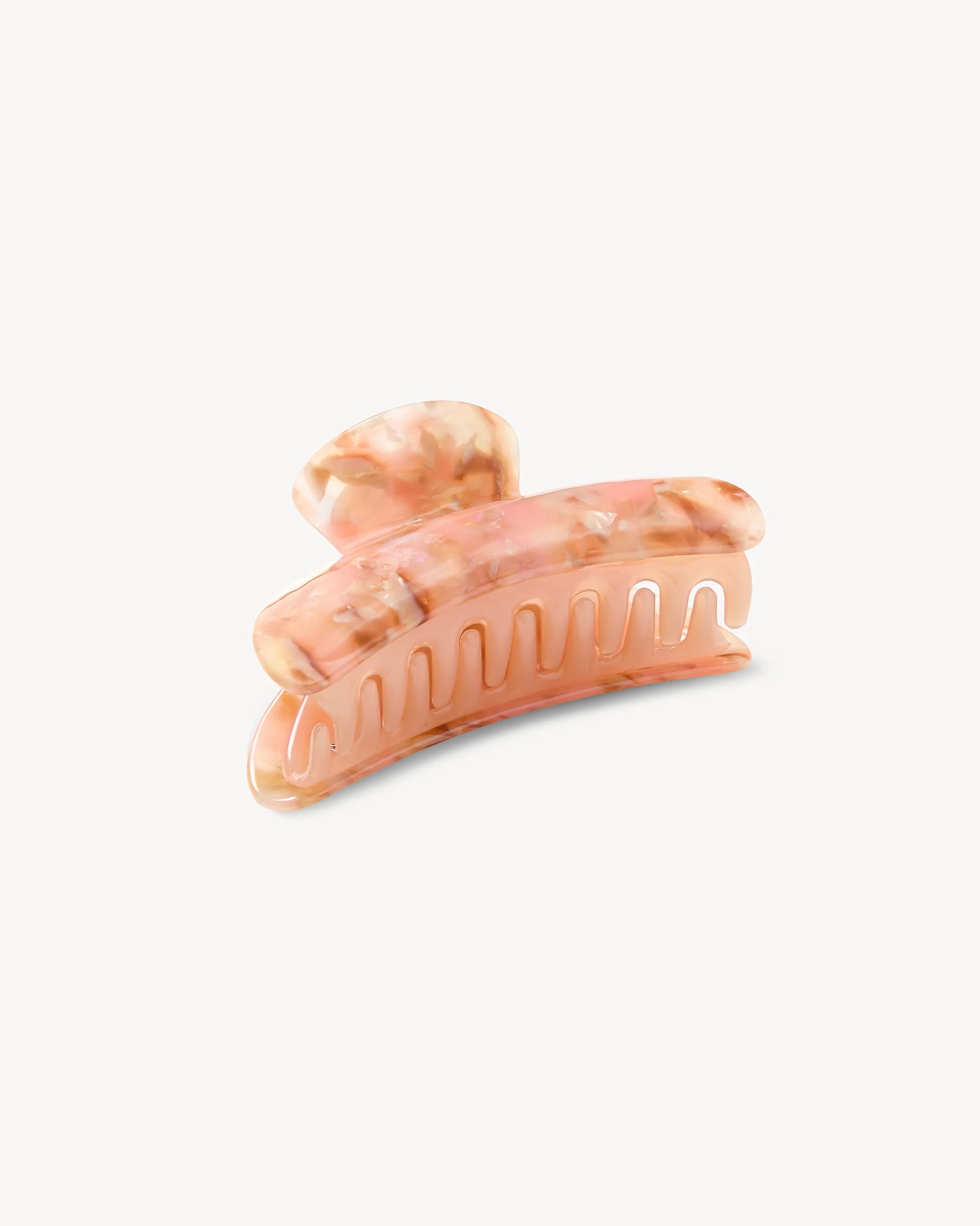 The Grande Heirloom Claw by Machete, crafted from premium Italian acetate in a marbled peach and cream design with interlocking teeth, is displayed against a plain white background—ideal for securing long, thick hair.