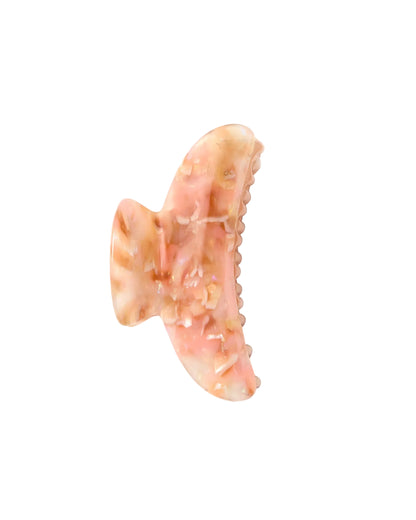 The Machete Grande Heirloom Claw is a pink and beige marbled hair claw clip, expertly crafted from premium Italian acetate with a curved shape and interlocking teeth—ideal for securing long, thick hair or styling large volume hair—shown against a white background.