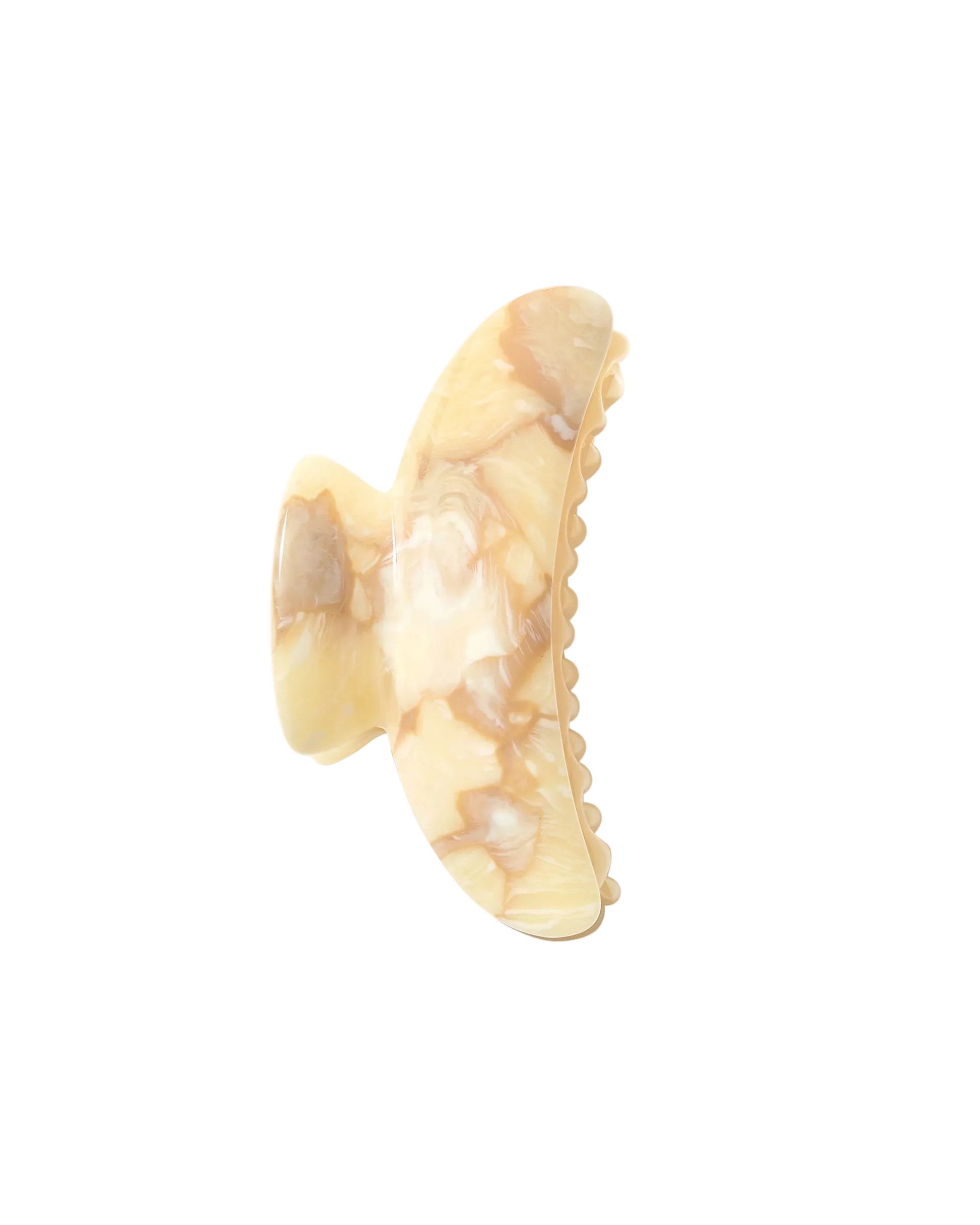 The Machete Grande Heirloom Claw, shown against a white background, is a beige and light brown marbled hair clip made from premium Italian acetate, featuring curved edges and interlocking teeth for a secure hold on long, thick, or voluminous hair.
