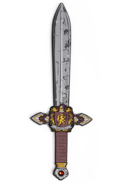 The Knights Honor Foam Sword by Great Pretenders features an illustrated medieval design with a weathered gray blade, an ornate gold and burgundy crossguard adorned with a lion crest, a wrapped handle, and a red gemstone pommel—perfect for imaginative play or as inspiration for dress-up adventures.