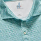 The Johnnie-O Featherweight Performance Fernando Polo, in turquoise with white buttons and a "johnnie-O" label, offers UPF 50 protection. Crafted with featherweight fabric, it combines the functionality of performance polos with a stylish design.