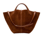 The Proenza Schouler PS Chelsea Large Soft Suede Tote in rich brown features a structured design with dual short handles and an adjustable shoulder strap for versatile carrying.