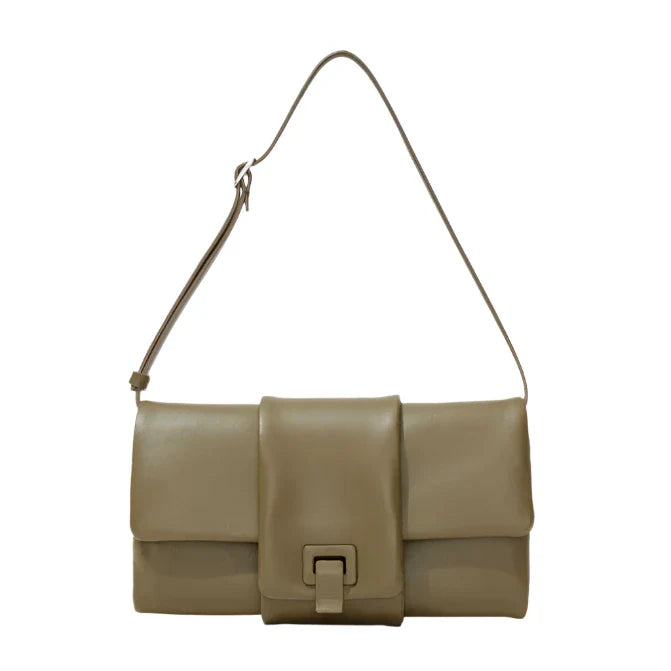 A Proenza Schouler Flip Shoulder Bag in beige nappa leather, featuring a long adjustable strap and a chic front flap with the signature PS1 buckle closure.