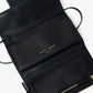 A Proenza Schouler Flip Shoulder Bag in black nappa leather features a PS1 closure and an open flap, revealing multiple compartments and a zipper pocket, with the brand name "Proenza Schouler" displayed in gold lettering.