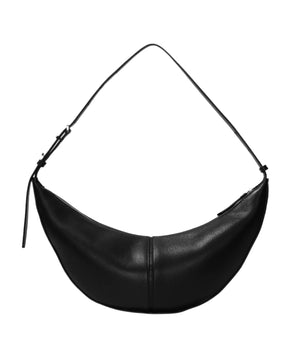 The Proenza Schouler Slide Bag is a black, crescent-shaped accessory made of supple leather, featuring a slender adjustable strap and zipper closure.