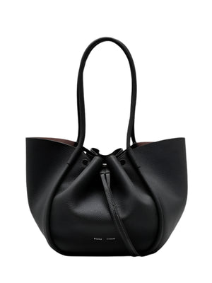 The Proenza Schouler Large Ruched Soft Pebbled Calf Tote is a black pebbled leather bag with two handles, a drawstring closure, and a detachable leather zip pouch.