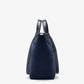 Side view of the Proenza Schouler Chelsea Large Soft Suede Tote in navy, showcasing its unstructured silhouette crafted from soft suede with black leather handles, set against a plain white background.