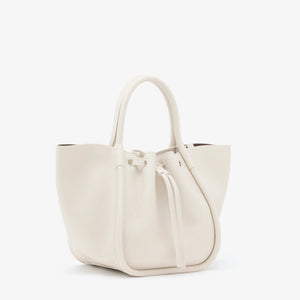 The Proenza Schouler Small Ruched Soft Pebbled Calf Tote in white leather features a sculptural silhouette, two handles, and a ruched open top with drawstring closure, shown against a plain white background.