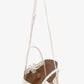 The Proenza Schouler Small Ruched Soft Pebbled Calf Tote is shown on a plain white background, featuring white leather, an adjustable shoulder strap, sculptural silhouette, drawstring closure, and brown interior.