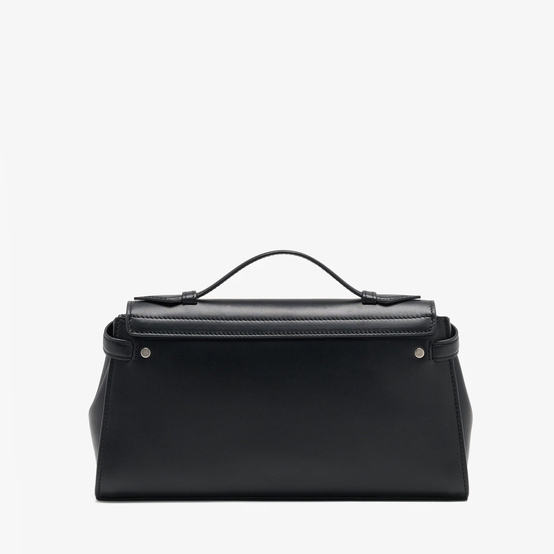 The Proenza Schouler Tate Clutch is a structured black leather bag featuring a top handle, silver hardware, and a flap closure. This compact accessory is shown against a plain white background.