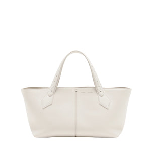 The Proenza Schouler East West Chelsea Tote is a spacious, white leather bag with two handles and a structured shape, featuring minimalist pebbled calfskin design, photographed on a plain white background.