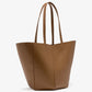 The Hex Tote by Proenza Schouler is a large brown leather bag with two long handles, crafted from smooth calf and shown against a white background.