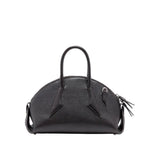 The Proenza Schouler Small Bowler Bag features black goatskin leather with a rounded top, two handles, and a textured finish. Silver hardware and a decorative tassel accent one handle, lending distinctive charm to this stylish accessory.
