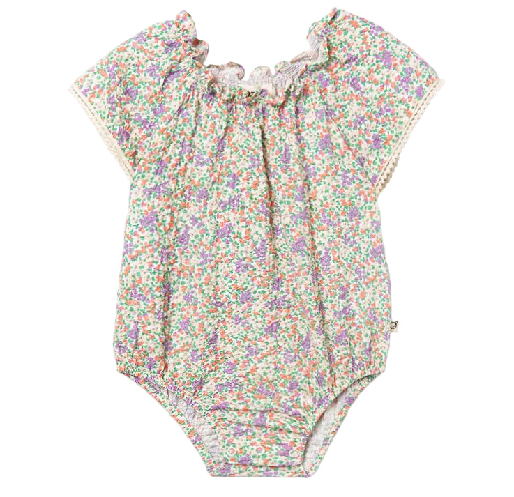 The Cozmo Baby Girls' Holly Floral Bubble features a ruffle neckline, short sleeves, and a multicolored floral print on soft white cotton voile.