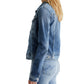 Side profile of a person wearing an AG Jeans AG Robyn Denim Jacket and matching jeans.