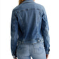 Back view of a person wearing an AG Robyn Denim Jacket made from AG Cloud Soft Denim™ and light wash jeans.