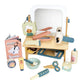 The Tender Leaf Hair Salon by Tender Leaf Toys provides countless styling possibilities with wooden tools, a mirror, toy magazine, and accessories in light blue, green, and natural wood tones. Ideal for budding stylists to embark on their own mini hair salon adventures.