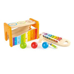 The Hape Pound & Tap Musical Bench is a wooden toy set that features a kid-friendly xylophone, three colorful balls, a mallet, and a bench with holes for the balls to drop through. This engaging musical toy helps develop hand-eye coordination while providing hours of fun play.