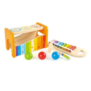 The Hape Pound & Tap Musical Bench is a wooden toy set that features a kid-friendly xylophone, three colorful balls, a mallet, and a bench with holes for the balls to drop through. This engaging musical toy helps develop hand-eye coordination while providing hours of fun play.