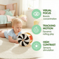 A baby lies on a rug, playing with the Hape Spinning Drum w/ Mirror—a black and white developmental toy designed to support visual focus, motion tracking, and sensory development through its high-contrast features. This engaging play encourages movement and helps your baby reach important early milestones.