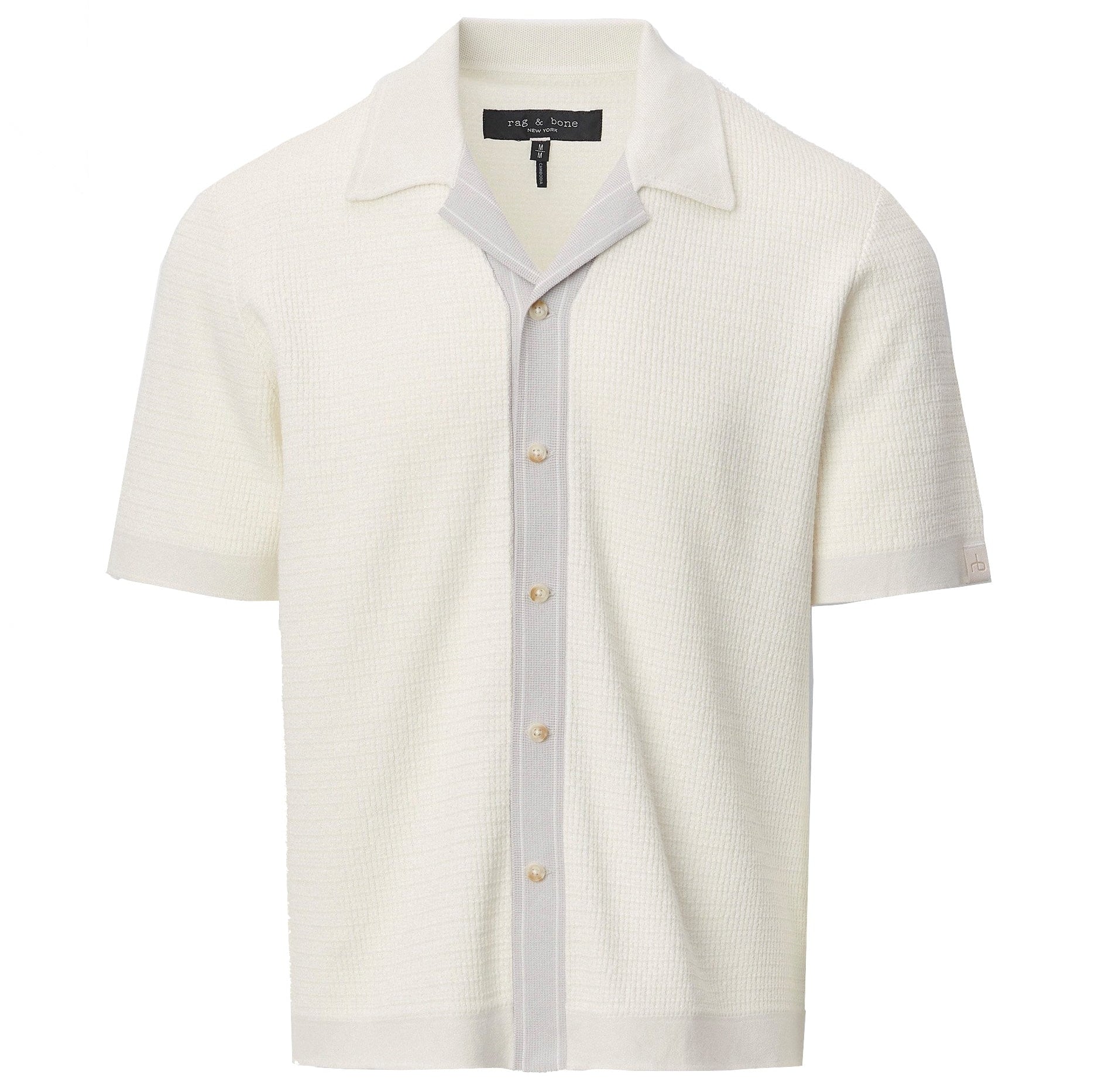 The Harvey Camp Shirt by Rag & Bone is a white short-sleeve knit shirt with textured button-up design, featuring a light gray vertical stripe along the placket and an open collar for retro flair.