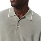 A man wears the Rag & Bone Harvey Knit Polo Shirt, a light green textured cotton-blend polo with white-tipped collar and buttons, shown from the shoulders up against a white background.