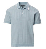 The Harvey Rib Polo by Rag & Bone is a light blue short-sleeve cotton-blend sweater featuring a textured pattern, white stripes on the collar and sleeves, and a three-button neckline.