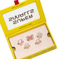 The Super Smalls Heartfelt Sparkle Ring Set comes in a yellow “Small But Mighty” box and includes five colorful kids’ rings with heart, butterfly, flower, pearl, and gemstone designs—perfect for dress-up fun.