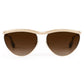 The Krewe Heidi Sunglasses feature a gold frame, brown gradient lenses, and an architectural metal brow bar, shown from the front against a white background.