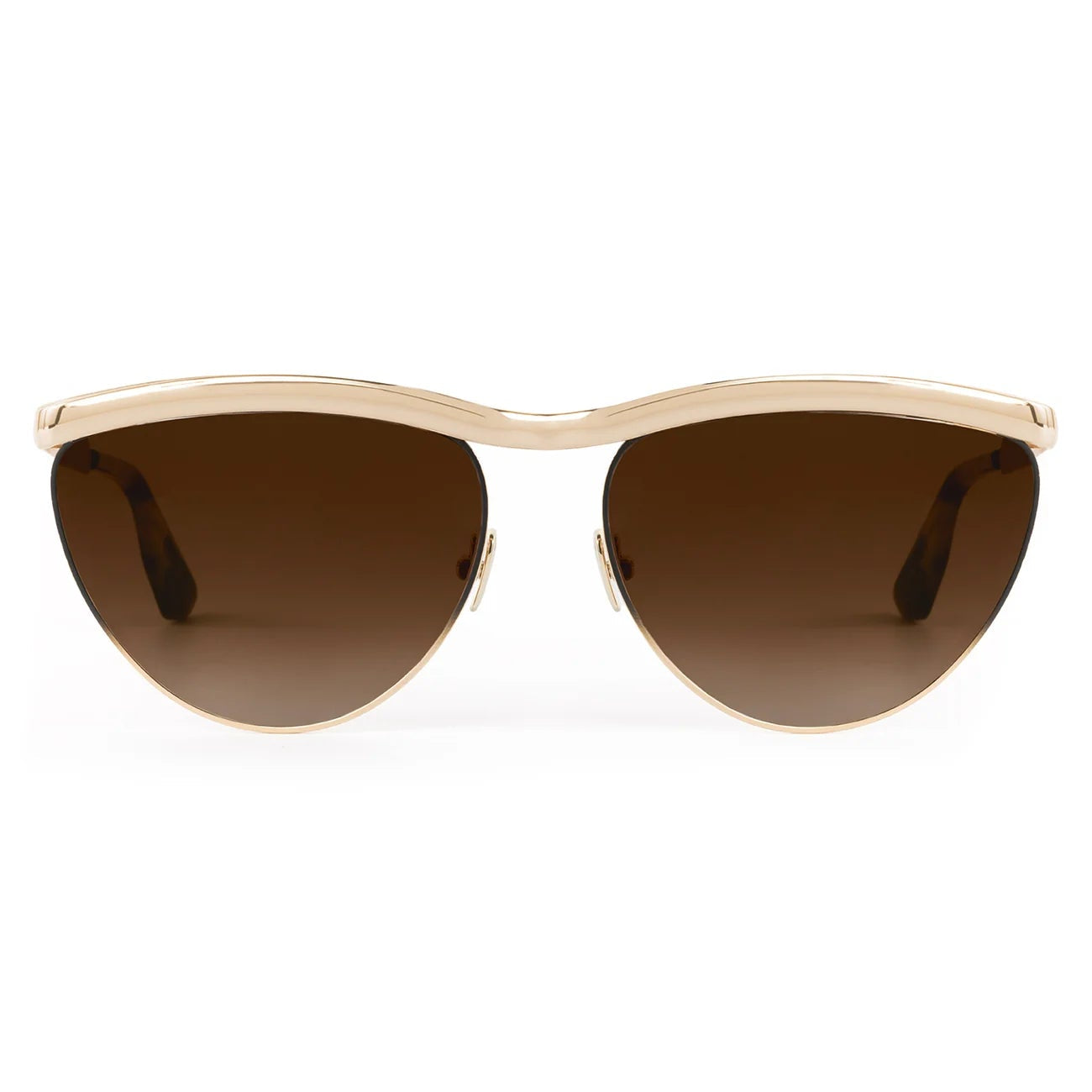 The Krewe Heidi Sunglasses feature a gold frame, brown gradient lenses, and an architectural metal brow bar, shown from the front against a white background.