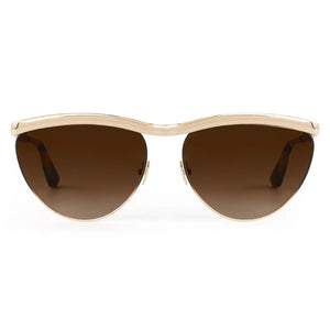 The Krewe Heidi Sunglasses feature a gold frame, brown gradient lenses, and an architectural metal brow bar, shown from the front against a white background.