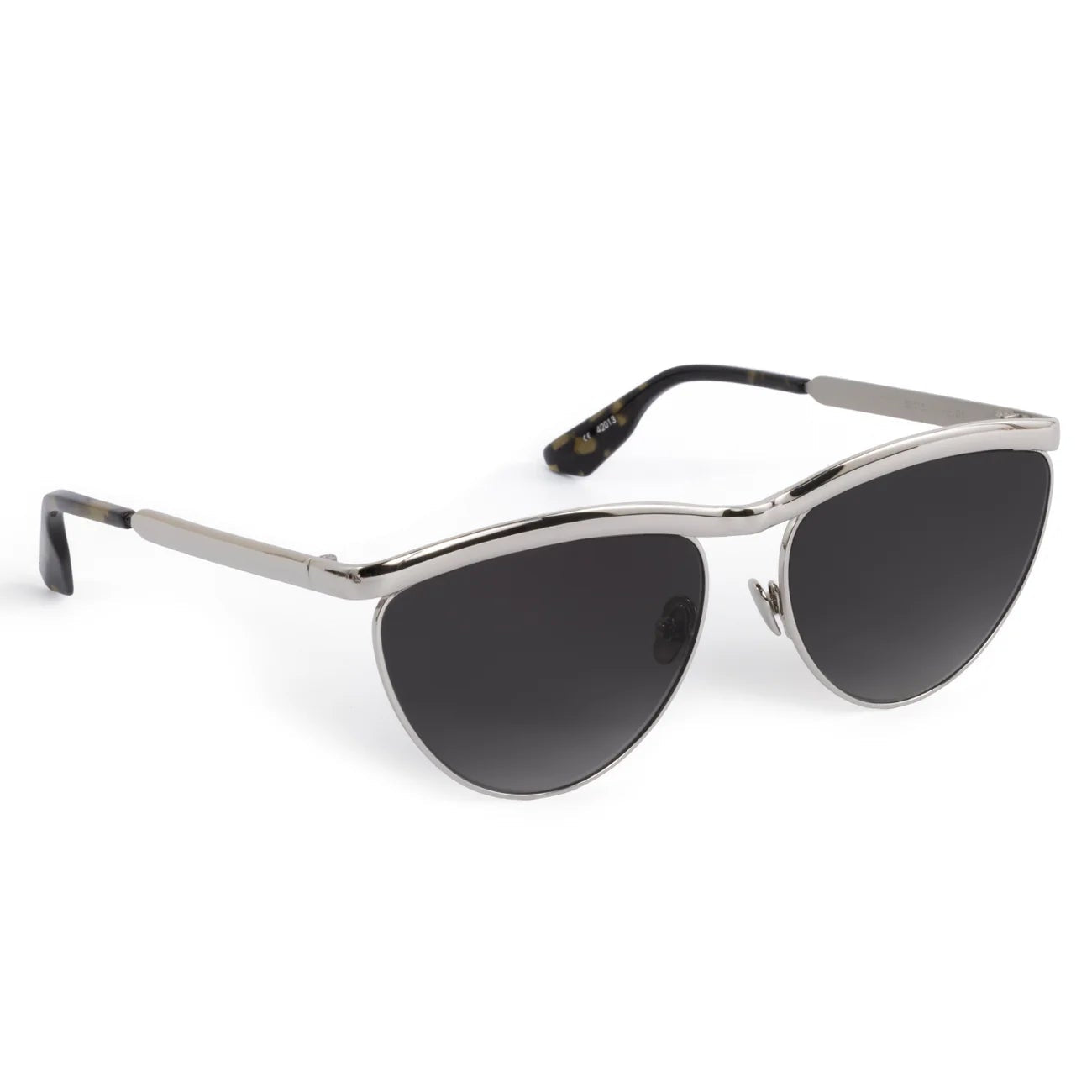 The Krewe Heidi Sunglasses feature a vintage-inspired cat-eye shape with a silver frame, black lenses, an architectural metal brow bar, and black temple tips, shown against a white background.