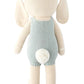 Henry the Bunny - Little 13" by Cuddle + Kind is a knitted stuffed bunny, shown from the back in a light blue outfit with a white pom-pom tail—an adorable gift for bunny lovers and friends who enjoy growing things together.