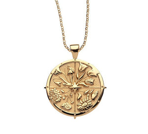 Jane Win Pendant Necklace Collection: Gold chain necklace with a round, coin pendant engraved with floral and leaf designs—beautiful, meaningful jewelry for any occasion. Displayed on a white background.