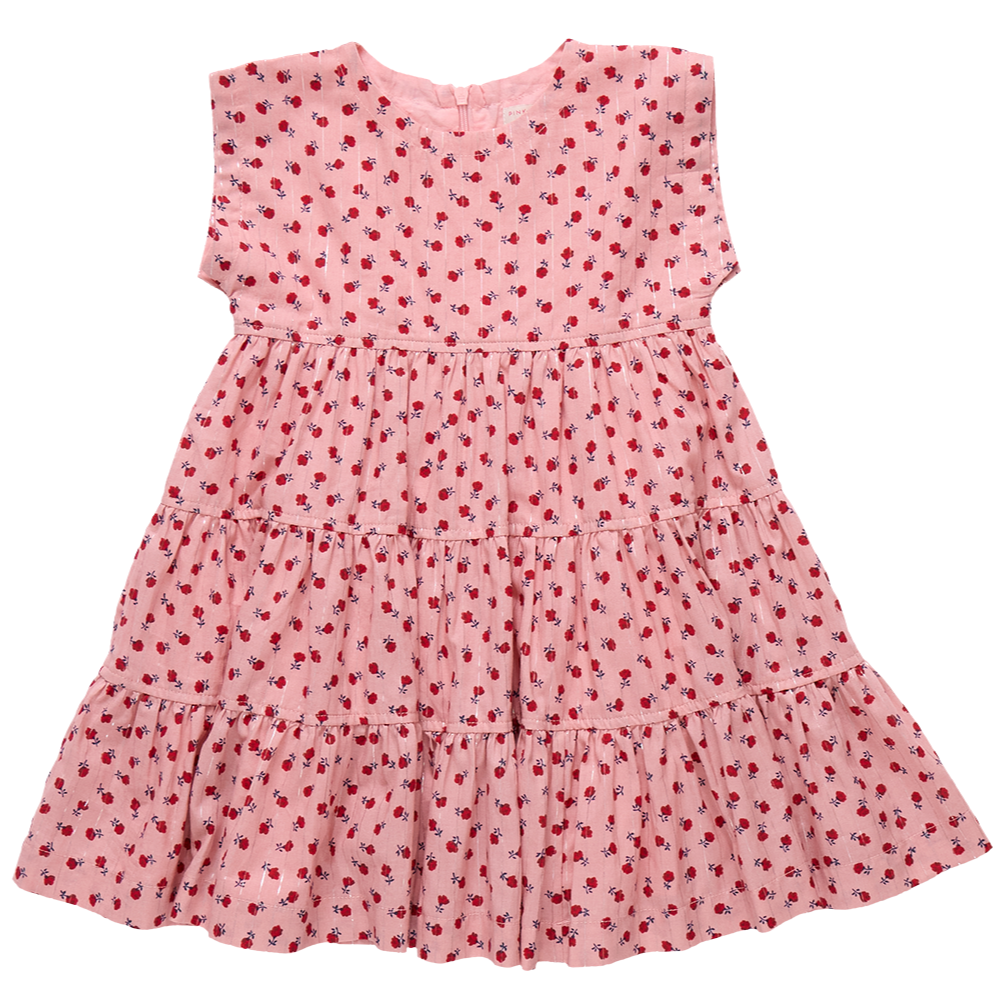 The Girls' Peachy Dress by Pink Chicken is a pink, short-sleeved, tiered dress adorned with a charming pattern of small red flowers.