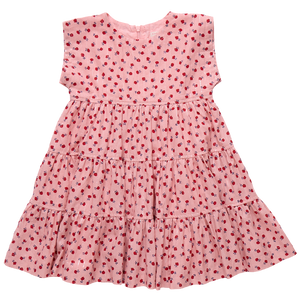 The Girls' Peachy Dress by Pink Chicken is a pink, short-sleeved, tiered dress adorned with a charming pattern of small red flowers.