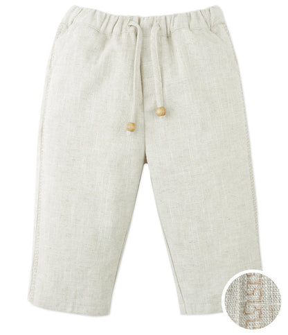 Gingersnaps Baby Boys' Erwin Pants in beige ramie blend with a garterized waist, drawstring with wooden beads, and straight legs. Fabric texture close-up is shown in the bottom right corner.
