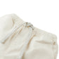 Close-up of the waistband on Gingersnaps Baby Boys' Huey Garterized Drawcords Shorts, featuring offwhite canvas, an elastic band, a drawstring, and a visible front pocket.