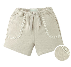 Gingersnaps Baby Boys' Marlow Drawstring Shorts feature beige textured cotton, an elastic waistband, contrast stitching on pockets, and a comfy fit—perfect everyday shorts for kids. Inset highlights the fabric's quality and detail.