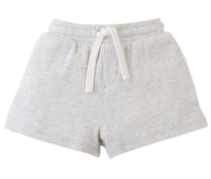 The Baby Boys' Eobard Waffle Knit Drawstring Shorts by Gingersnaps feature a light gray ribbed texture, white drawstring, and side pockets, shown on a white background.