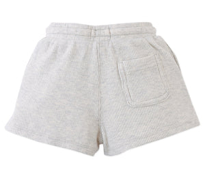The Gingersnaps Baby Boys' Eobard Waffle Knit Drawstring Shorts feature a light grey fabric, elastic waistband, and a single front patch pocket, shown against a white background.
