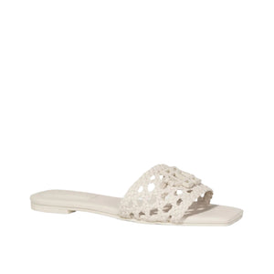 The Dion Woven Slide by Simkhai features a white woven vegan leather upper strap and an open toe design, showcased against a plain white background to emphasize its distinctive texture.