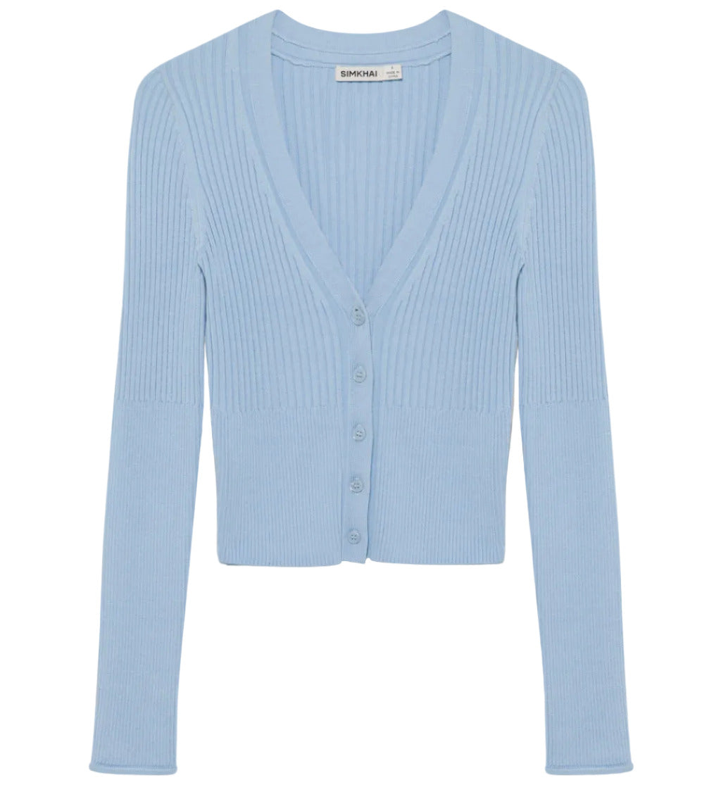 The Ailany Cardigan by Simkhai is a light blue ribbed knit piece with long sleeves, a V-neckline, and button front closure, shown on a plain white background.
