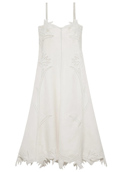 The Ellery Bustier Midi Dress by Simkhai is a sleeveless white linen-blend dress with thin straps, floral embroidery on the bodice and skirt, and a scalloped hem with delicate flower petal details.